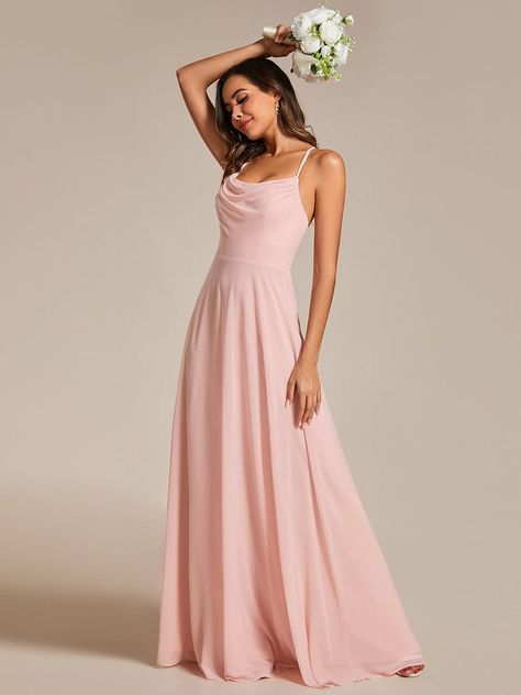 Grace the aisle in our Flowy Back Criss-Cross Swing Collar Sleeveless A-Line Bridesmaid Dress. The swing collar and sleeveless design exude modern charm, while the criss-cross back detailing adds a touch of sophistication. With a flowing A-line silhouette, this bridesmaid dress combines elegance with comfort, ensuring a memorable celebration. Fit: Please refer to size chart. Length: Floor Length. Sleeve Style: Sleeveless. Closure: It is concealed a zipper up the back. Undergarments: It is padded Pastel Pink Bridesmaid Dresses Long, Spaghetti Strap Bridesmaid Dress, Pink Bridesmaid Gowns, Bridesmaid Gown Chiffon, Spaghetti Strap Bridesmaids Dresses, Goddess Gown, Dresses Flowy, Draped Collar, Pink Bridesmaid Dresses