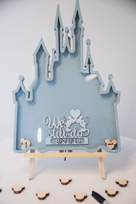 Alternate guest book shaped as Cinderella's castle with Mickey heads for guests to sign at a Disney wedding Disney Wedding Guest Book Ideas, Disney Wedding Guest Book, Wedding Disney Ideas, Disney Wedding Signs, Subtle Disney Wedding Ideas, Disney Wedding Ideas Decorations, Cinderella Wedding Ideas, Subtle Disney Wedding, Disney Theme Wedding