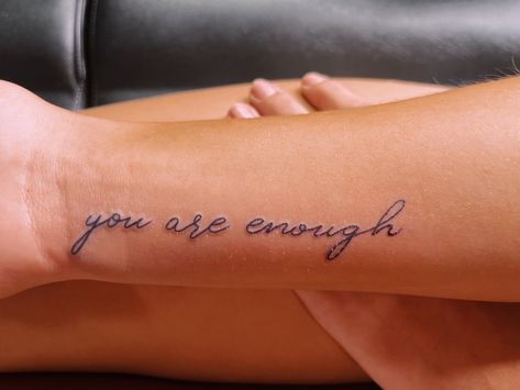 You Are Enough Cursive Tattoo, Cursive Name Tattoo With Butterfly, You Are Enough Wrist Tattoo, Enough Cursive Tattoo, Know You’re Enough Tattoo, You Are More Than Enough Tattoo, I Am Enough Quotes Tattoo With Butterfly, Jireh You Are Enough Tattoo, You’re Enough Tattoo