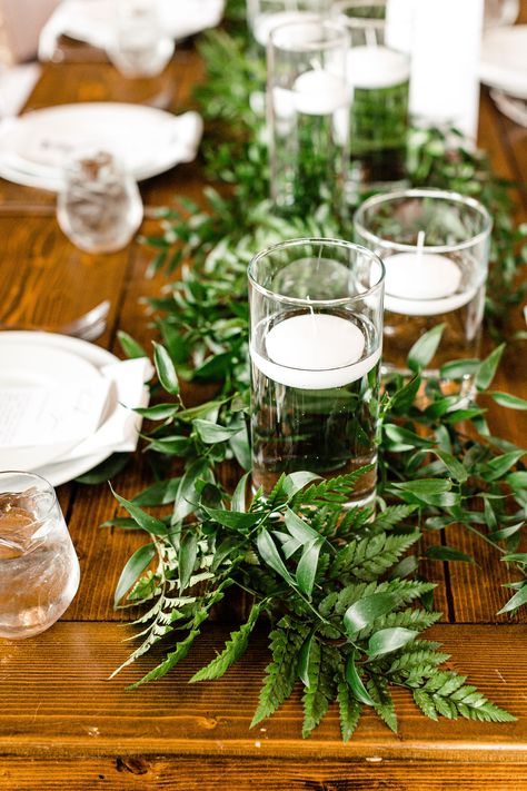 Wedding reception table runner, Italian ruscus, greenery, leatherleaf, floating candles, farmhouse table, classic wedding, whimsical wedding, white wedding, Spring wedding, Pear Tree Estate, Champaign wedding, Illinois wedding, central Illinois wedding, midwest wedding, J.Blu Wedding Florist, Peoria wedding, NRS Photography, table runner, wedding table runner, candle table runner, wedding reception, reception decor, greenery table runner, floating candles, wedding centerpiece, wedding flowers Fern Centerpiece Wedding, Fern Wedding Decor, Reception Table Runner, Italian Ruscus Greenery, Spray Roses Boutonniere, White Spring Wedding, Ruscus Greenery, Greenery Wedding Table, Greenery Runner