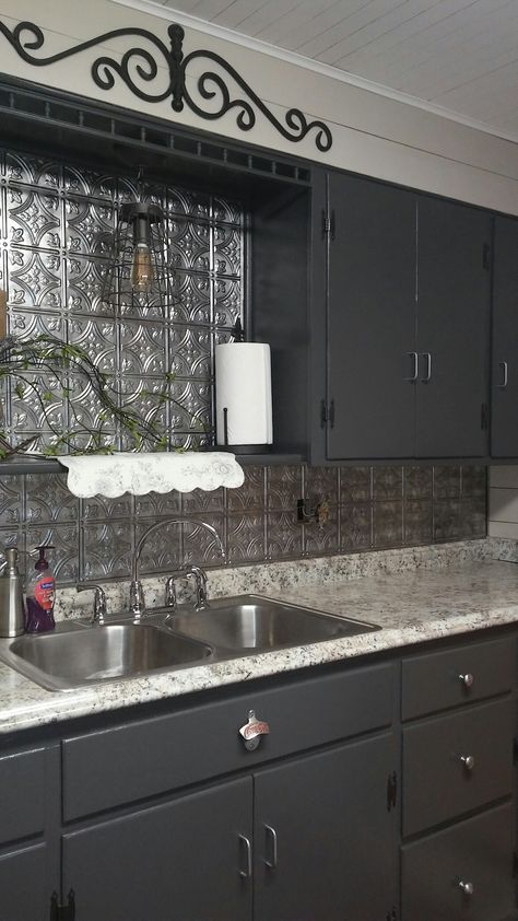 Fasade backsplash tiles.  Behr Asphalt gray cabinets. Fasade Backsplash Kitchen, Backsplash With Black Cabinets, Tile Back Splash, Dark Grey Kitchen Cabinets, Dark Grey Kitchen, Tin Tiles, Backsplash Tiles, Kitchen Refresh, Gray Cabinets