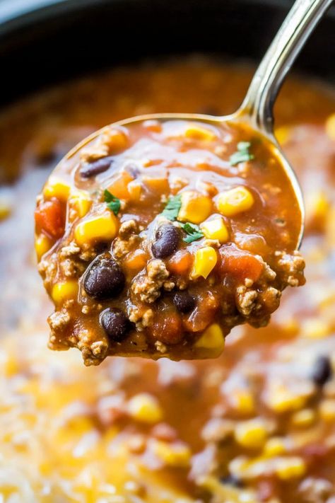 Looking for a delicious and easy dinner idea? Try this flavorful crock pot beef taco soup recipe! Packed with savory beef, tasty spices, and hearty beans, this dish is perfect for a cozy family meal or entertaining guests. Simply set it and forget it in your slow cooker for a meal that's sure to satisfy everyone at the table. Serve with your favorite toppings like shredded cheese, sour cream, and crispy tortilla strips for a tasty twist on taco night. Crockpot Taco Soup Beef, Beef Tortilla Soup, Beef Taco Soup, Healthy Crock Pot, Soup Lovers, Canning Sweet Corn, Tortilla Strips, Crock Pot Beef, Bean Varieties