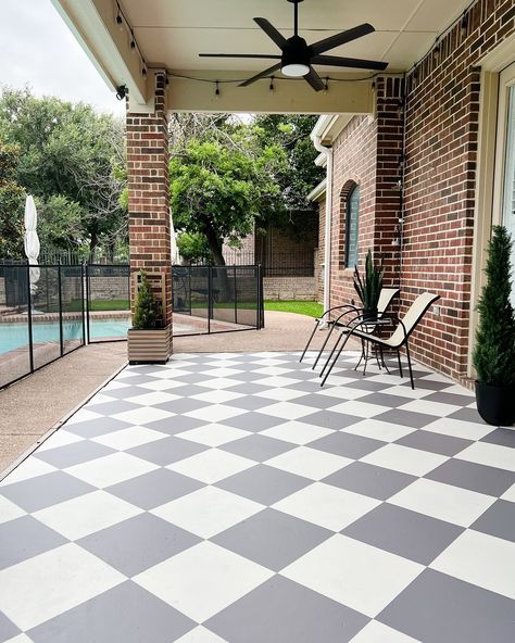 I painted my patio floor! I’ve been wanting to do this checkered pattern for a while but in between other projects and school activities it’s been a wild couple of months. When my stepdad offered to help me I took him up on his offer and we were able to do it in 2 days! While I love love the results I would not do it that fast again. 😂 I must have done 1000 squats in between drawing out the lines, taping and painting. I still have a few places where touch ups are needed but overall I’m so h... Painted Balcony Floor, Checkered Porch Floor, Painted Checkered Floor, Checkered Patio, Tile Patio, Outdoor Tile Patio, Balcony Floor, Paint Concrete Patio, Printed Concrete