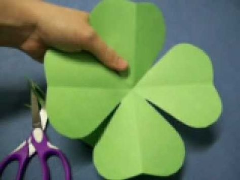 In this tutorial, we learn how to make a four leaf clover pattern. First, fold your paper in half, then fold it in half in the other direction. Next, fold the edges making a point and then cut a half an inch along the edge, making a cone shape. end the shape on the right side, making a heart shape. When you unfold, you will have a four leaf clover! You can use any size of paper to make this, just make sure you use green paper to keep the theme Irish. This is a great project for kids to learn ... Clover Craft, St Patricks Crafts, Clover Pattern, Project For Kids, St Patrick's Day Crafts, Green Paper, St Paddys Day, Four Leaves, Paper Flowers Diy