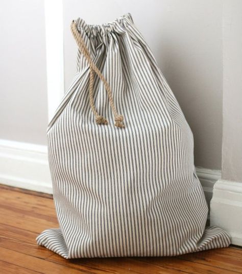 How to Sew a Drawstring Laundry Bag | eHow Laundry Bags Diy, Diy Sac Pochette, Beginner Sewing, Beginner Sewing Projects Easy, Bag Sewing, Leftover Fabric, Sewing Projects For Beginners, Easy Sewing Projects, Diy Sewing Projects