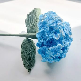 The hydrangea represents gratitude, grace, and beauty. Learn how to make some gorgeous hydrangeas with this tutorial. They look so realistic, and they'll never wilt on you! Crocheted Hydrangea Flowers, Crochet Flowers Hydrangea, Hydrangea Bouquet Crochet, Beautiful Crochet Ideas, Crochet Blue Flowers Free Pattern, Hydrangea Crochet Pattern, Crochet Hydrangea Pattern Free, Microcrochet Flower, Free Flower Crochet Patterns