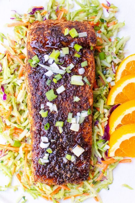 A great rub of spices, brown sugar and lemon zest make this sweet and spicy salmon a light flavorful dish. Perfect for large crowds or just two. The spice blend creates a glaze when baked and a very tasty flavor combination. Sweet And Spicy Salmon, Maple Syrup Salmon, Salmon Baked, Salmon Soy Sauce, Marinated Salmon, Gluten Free Chili, Spicy Salmon, Salmon Dishes, Roasted Salmon