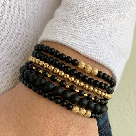 A little everyday sparkle stack! Set includes: one 4mm black onyx bracelet with your choice of sterling silver or 14k gold filled sparkle beads and a 6mm black onyx bracelet. Easy wear and effortless bracelet stacking with stretch cord design. Sizing options to make sure you have the perfect bracelet fit. Black Stackable Beaded Bracelets For Everyday Wear, Wood Bead Bracelet Ideas, Black Bracelet With Gold Beads, Everyday Black Faceted Beads Bracelet, Adjustable Stacked Black Beaded Bracelets, Everyday Hand-strung Black Beaded Bracelets, Essential Jewelry, Bracelet Easy, Stack Bracelet