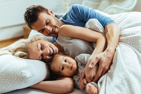 Young happy family embracing while lying... | Free Photo #Freepik #freephoto #family-love #family-bed #couple-sleeping #family Family Sleeping Together, Family Vision Board, Family Vision, Cuddles In Bed, Family Bed, Sleeping Together, Couple Sleeping, Laying In Bed, Jones Family