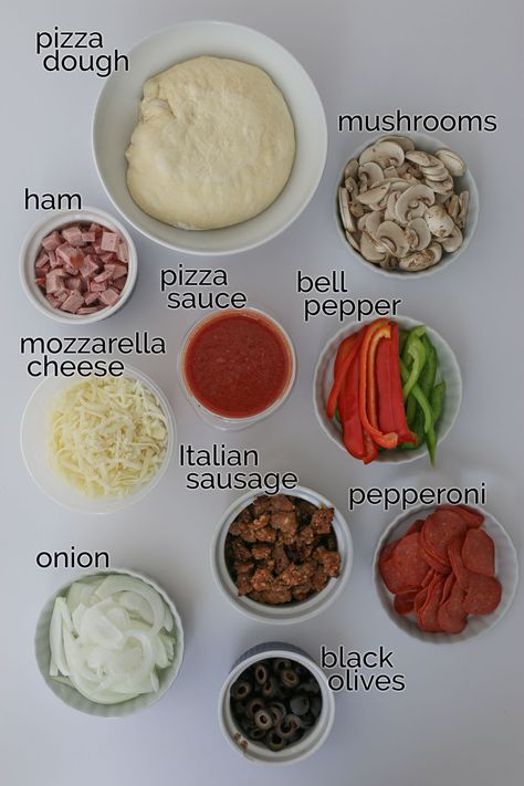 Make pizza night super duper out of this world with this Homemade Supreme Pizza recipe featuring a hearty combination of vegetables and meat. This recipe is a great DIY alternative to the pizzeria classic that you can customize supreme pizza toppings to your personal preferences -- without paying extra! Supreme Pizza Toppings, Pizza Diy Homemade, How To Make Your Own Pizza, Make Ur Own Pizza, Homemade Pizza Ingredients List, Pizza Ingredients List Recipe, Goofy Movie Pizza Recipe, Pizza Topping Ideas Homemade, Homemade Pizza Recipe Toppings