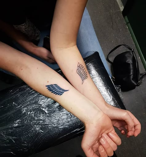 Haileii Ballas on Instagram: “Cute Attack on Titan themed couple tattoos from today for Phil and Bec! Thanks so much guys! 🤗😄 Just in time for season 3!! 😎 #tattooart…” Anime Siblings Tattoo, Aot Matching Tattoo, Couple Anime Tattoo, Couples Anime Tattoos, Subtle Attack On Titan Tattoo, Matching Anime Tattoos Couples, Matching Tattoos Anime, Anime Couple Tattoos, Anime Matching Tattoos