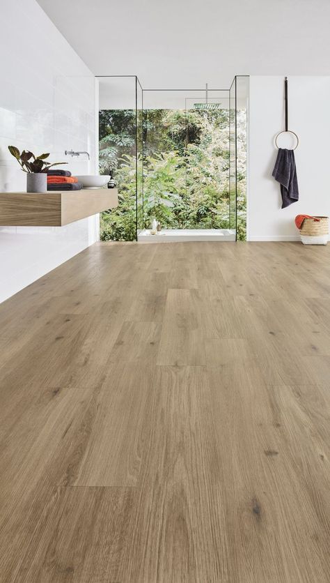 Canadian Urban Oak LVP flooring shown in a minimalist Scandi-style bathroom, followed by a close-up angled image. Neutral Flooring, Oak Laminate Flooring, Lvp Flooring, Scandinavian Bathroom, Industrial Farmhouse, Floor Colors, Commercial Flooring, Vinyl Plank Flooring, Underfloor Heating