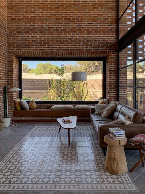 Casa Pereki is an "off the grid" house located in San Miguel de Allende, Mexico. Designed -and almost self-built- by the oners in 2016, was finally finished in 2022. Inspired in the several brick factory in the area, it shows a mixture of industrial architecture, with exposed materials: brick, concrete, iron, etc. but softened with simple shapes, straight lines, light & furniture made of wood, clay, stone and even plastic #interiors #interiorstyle #design #interiordesign #lounge #architecture Lounge Architecture, Earthy Interior, Cement House, Brick Furniture, Brick Factory, Brick House Designs, Urban Rooms, Light Furniture, Steel Architecture