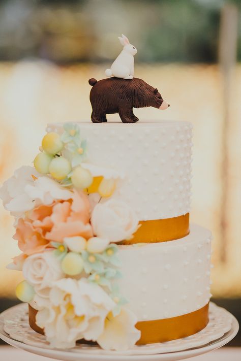 Beautiful wedding cake with sugar flowers and the cutest cake topper - a bunny sits atop a grizzly bear #caketopper #wedding #weddingcake Bear Wedding Cake Topper, Bunny Wedding Cake, Pleasant Grove Utah, Halloween Wedding Cakes, Gold Wedding Cakes, Wedding Cake Figurines, Nature Themed Wedding, Bear And Bunny, Funny Wedding Cakes