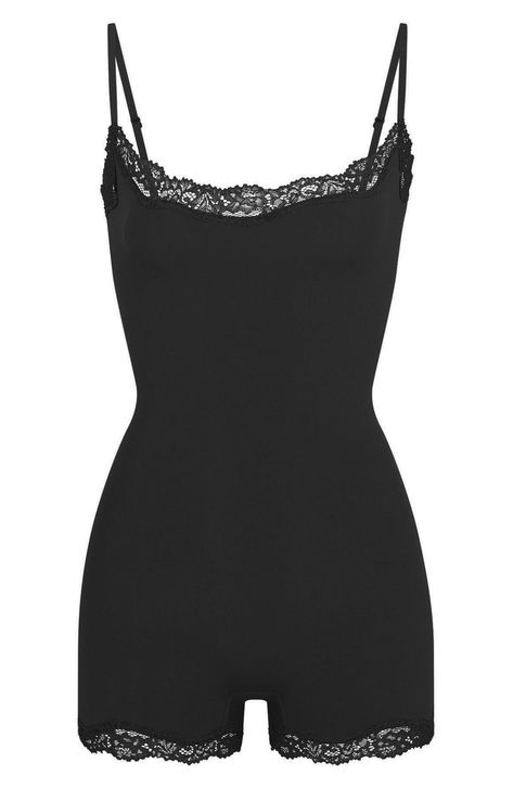 Love to lounge in this buttery-soft cami romper crafted with romantic lace trim from Kim Kardashian's SKIMS. Pull-on style Scoop neck Adjustable straps Lined gusset 76% polyamide, 24% elastane Machine wash, dry flat Imported Black Lace Romper Outfit, Pajama Bodysuit, Body Suit Shorts, Skims Pajamas, Skims Outfit, Pj Romper, Black Loungewear, Girlfriend Clothes, Black Lace Romper