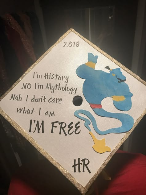 Disney’s Aladdin-inspired graduation cap. Genie traced from a stencil, cut with an exacto knife, painted, then hot glued to card stock on top of cap. Graduation Cap Designs Disney, Biology Graduation Cap, Disney Grad Caps, Disney Graduation Cap, Teacher Graduation Cap, Funny Graduation Caps, Creative Graduation Caps, Graduation Box, Disney Graduation