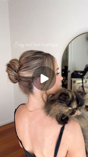 Jody Callan Hair on Instagram: "Easy textured mid bun how to and kisses from Furby 🐱

Mid buns are in and old songs are new again 🎶

Glow @lillyrathie 
Model @gracecribb 

#tutorial #throwback #hairtutorial" Mid Height Bun, Voluminous Bun Tutorial, One Minute Elegant Bun, 2000s Bun Tutorial, How To Make Bun Look Fuller, Old Songs, Buns, Hair Tutorial, Songs