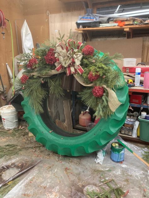 Tractor Tire Wreath, Farm Decorations, Barn Christmas, Wheel Christmas Wreath, Tire Projects, Oversized Christmas Decorations, Tractor Tire Wreath Christmas, Tire Wreath Christmas, Jeep Tire Christmas Decorations