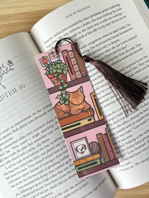 2 in by 6 in.  Design is one sided Colors may vary slightly in person. Cat Bookmark, Handmade Bookmarks Diy, Page Holder, Bookmark Printing, Creative Bookmarks, Bookmark Craft, Book Challenge, Cute Bookmarks, Gifts For Librarians