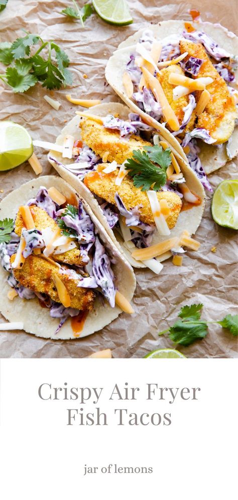 Three fish tacos on parchment paper. Crispy Air Fryer Fish, Air Fryer Fish Tacos, Cheese Cabbage, Cilantro Tacos, Fish Tacos With Cabbage, Breaded Cod, Air Fried Fish, Healthy Taco Recipes, Lime Slaw