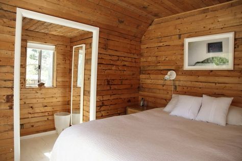 The Impossible Has Happened: 25 Examples of Wood Paneling Done FABULOUSLY | Apartment Therapy Knotty Pine Paneling, Wood Walls Bedroom, Knotty Pine Walls, Pine Wood Walls, A Cabin In The Woods, Pine Walls, Attic Apartment, Knotty Pine, Bedroom Panel