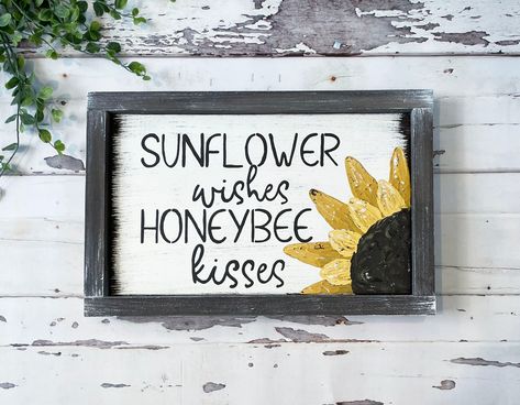 "Add a little farmhouse style to your home with this adorable hand painted \"Sunflower Wishes, Honey Bee Kisses\" framed sign. The sunflower is hand painted with a palette knife to give dimension and texture! The back ground is white and the frame is a brown. *Due to being hand painted, the details of the sunflower may vary from the listing picture.* This is PERFECT to add to your home decor or would make a wonderful gift. This framed sign would look beautiful hanging on your wall, or on your ma Farmhouse Sunflower Decor, Sunflower Home Decor Diy, Honey Bee Decor Diy Kitchen, Bee And Sunflower Decor, Bee Signs Ideas, Honey Bee Kitchen, Sunflower Sayings, Diy Bees, Bee Farmhouse Decor