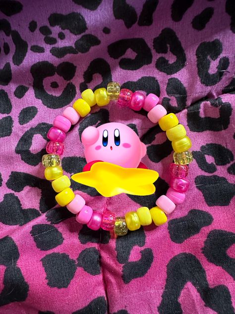 pink & yellow 💛  + glitter pony beads ✨ handmade kandi bracelet single - LUVSCENE Frog Kandi Bracelet, Kirby Kandi Pattern, Kandi Inspiration Pony Beads, Big Kandi Cuff, Kandi Bracelets Ideas Singles, Yellow Bracelet Ideas, Kirby Bracelet, Aroace Bracelet, Pony Bead Bracelets Patterns