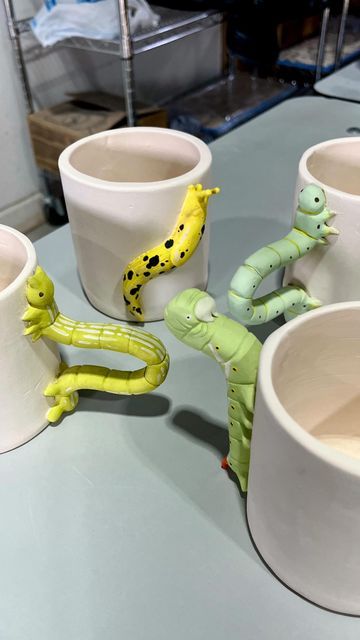 haley :) on Instagram: "what type of caterpillar/inchworm should i put on a mug next?? 🐛☕️

#smallartist #ceramicart #traditionalart #potterytiktok #natureart #entomology #bugart #handmademug #ceramicmug" Clay Snail Mug, Animal Mugs Clay, Caterpillar Mug, Alice In Wonderland Caterpillar Clay, Clay Monster Mug, Bug Art, Caterpillar, Traditional Art, Clay Crafts