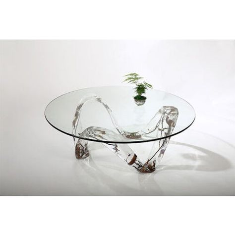 Round Luxury Table This magnificent round coffee table is both functional and elegantly designed. It is a wonder of craftsmanship and will add a sense of sophistication and flair to any room in your home, office, or business. Perfect for displaying luxury accessories, this table is a real work of art.  Description With a round glass top, this end table is exquisitely designed. The base is eye-catching, made with crystal mixed with acrylic and organic wooden elements. This table is functional but also a breathtaking feat of design.  Round End Table Features  A flat glass top may be used to display luxury pieces. Crystal mixed with the acrylic base with beautiful natural wood branches A unique and one of a kind piece that will wow guests Easily maintained high-end piece of decor Crystal Furniture, Oval Glass Coffee Table, Silver Coffee Table, West Elm Coffee Table, Coffee Table Size, Round Wood Coffee Table, Diy Abstract Canvas Art, Home Coffee Tables, Luxury Table