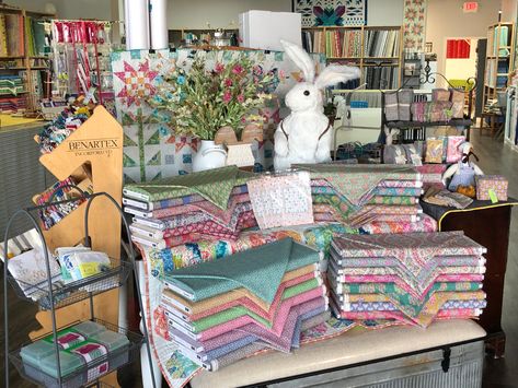 Always pampering your fabric addiction with modern fabrics and great online groups and classes Sewing Window Display, Quilt Store Display Ideas, Quilt Shop Ideas, Quilt Shop Displays, Fabric Shop Display, Fabric Store Displays, Fabric Store Design, Sugar Land Texas, Quilt Display