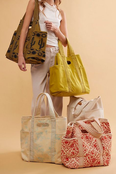 Carry it all in this roomy tote, featured in a classic canvas fabrication with built-it top handles and contrast-seamed shoulder straps. **Features:** Tote style, canvas fabrication, spacious interior, 3 exterior pockets, built-in top handles, contrast-seamed shoulder straps **Why We | Caravan Canvas Tote Bag by FP Collection at Free People in Yellow Patchwork Tote Bags, Textile Bag, Diy Bags Patterns, Tote Bags Sewing, Fabric Tote, Zippered Tote, Tote Bag Pattern, Fabric Bags, Cute Bags