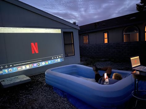 movie night with projector screen and blow up pool Outside Movie Night Ideas Outdoor Projector, Movie Night In Pool, Projector Date Night, Blow Up Jacuzzi Ideas, Outside Projector Screen Backyards, Projector In Yard, Movie Night Balcony, Movie Outside Aesthetic, Projector Backyard