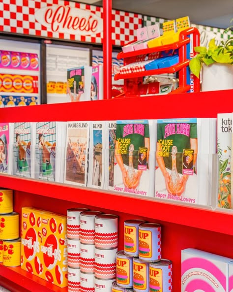 Superette's retro bodegas are stylishly avant garde. Bursting with bright colors and kitschy decor, the chain's designers drew inspiration from familiar spaces (minimarts and neighborhood delis, for example) to create destinations that are at once outlandish, comforting, and rebelliously imaginative. #cannabisindustry #retaildesign #interiordesign #retail #superette #dispensarydesign Retro Grocery Store Aesthetic, Cool Convenience Store, Vintage Grocery Store Aesthetic, Bodega Aesthetic, Retro Grocery Store, Retro Grocery, Emily Robinson, Supermarket Sweep, Grocery Store Design