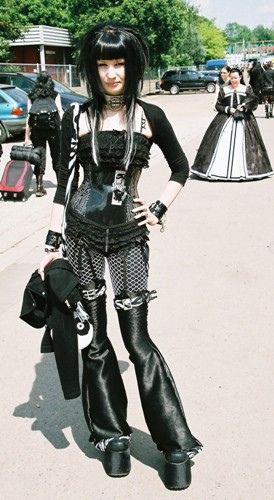 Goth (not really a dress, I know...) Punk Outfits Fishnets, Gothic Leather Dress, Old School Goth Fashion, Cybergoth Outfit Women, Futuristic Goth Fashion, Studded Bra Outfit, Black Goth Fashion, Goth Fishnet Outfit, Dark Wave Fashion