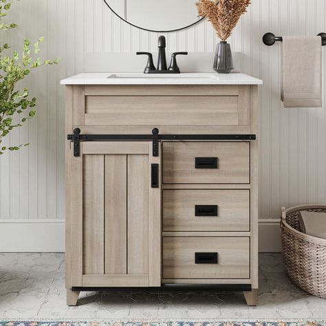 Revamp your bathroom with the farmhouse styling of the Morriston Bathroom Vanity from Style Selections. Pull out drawers provide ample storage for all your essentials, and the functional rustic barn door will be admired by family and guests. The timeless light brown finish of the vanity and black hardware exudes a classic look that will match your décor. The vanity includes a white engineered stone top (predrilled for an 4-inch centerset faucet), a 4-inch optional matching backsplash, updated furniture grade vanity feet, and a white ceramic rectangular undermount sink. Built for style and fully assembled, this vanity is the perfect choice for a bathroom upgrade that will last for years. Style Selections Morriston 30-in Light Brown Undermount Single Sink Bathroom Vanity with White Engineere Gray Tile Bathroom Floor Wood Vanity, Bathroom Single Sink Vanity, Updated Furniture, Small Bathroom Redo, Small Bathroom Vanity, Vessel Sink Bathroom Vanity, 24 Inch Vanity, Farmhouse Styling, Paint Bathroom