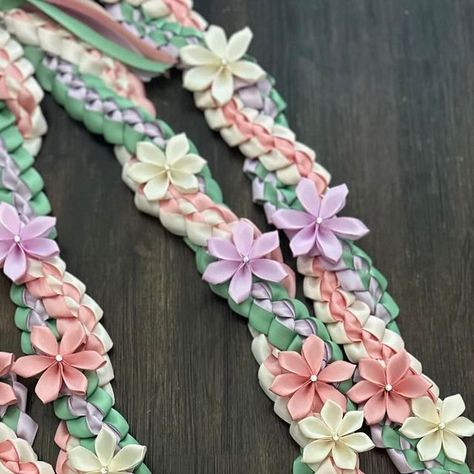 Philipa “iLee” Gaviola on Instagram: "I have NOT done lei in this color combo palette before. Im soo in love with how it came together.   This lei inspiration was by @rissaspieces1 beautiful lei creations. Thank you for inspiring me. 💖  Made this stole/sash and lei for a special 👩🏻‍🎓graduate. @dottiewas  • • • • • • • • • • • Single braided & Twist tied in peachy 💗, lavender 💜, beige 🤍, sage 💚ribbon.  #ribbonleis #ribbonlei #ribbonleimaking #graduation2024 #graduationlei #sanjose #bayarealeimaker #graduationribbonleis🎓 #graduationribbonlei #ribbonleis2024 #gradleisforsale" Color Combo Palette, Braided Twist, College Grad Cap Ideas, Graduation Money Gifts, Senior Stuff, Ribbon Lei, 8th Grade Graduation, Graduation Money, Single Braid