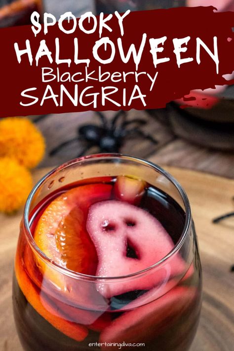 Extremely delicious and spooky Halloween blackberry sangria, made out of red wine, fresh fruits, blackberry brandy, triple sec and a ghostly garnish that is sure to amaze your Halloween party guests! Skeleton Sangria Recipe, Halloween White Sangria, Bubbly Sangria Recipes, Halloween Wine Night Snacks, Sangria Recipes Halloween, Halloween Wine Night Ideas, Sangria Cocktail Recipes, Sangria Party Ideas, Halloween Drink Pitcher