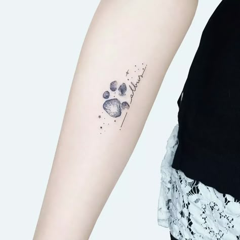 26 Adorable Paw Print Tattoo Ideas for Men & Women in 2023 Watercolor Cat Paw Tattoo, Fine Line Paw Print Tattoo, Pet Paw Print Tattoo, Paw Tattoos For Women, Dog Paw Tattoos For Women, Cat Print Tattoo, Cat Paw Tattoo, Paw Tattoo Ideas, Cat Paw Print Tattoo