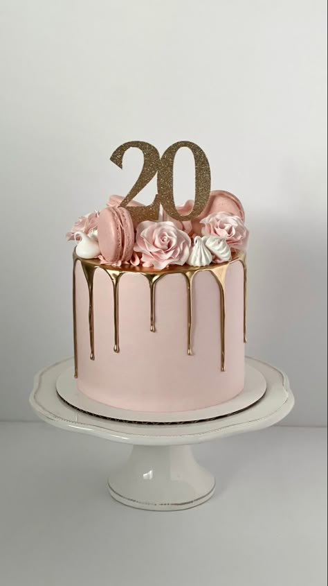 Pink cake with a gold drip. The top is decorated with pink sugar roses, pink macarons and white meringues. A sparkly, gold cake topper sits in the middle and reads “20”. Tårta Design, Modern Birthday Cakes, 20th Bday, 14th Birthday Cakes, 20 Birthday Cake, Small Birthday Cakes, Cake With Flowers, 13 Birthday Cake, Sweet 16 Birthday Cake