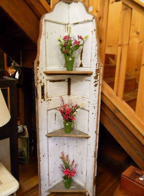 Old door turned into shelving unit. Annabelle's room Old Door Shelf Ideas, Shelves From Old Doors, Rustic Corner Shelf Using An Old Door, Old Door Corner Shelf, Outdoor Couch Diy, Antique Doors Shelf, Old Door Decor, Corner Shelf Ideas, Old Door Projects