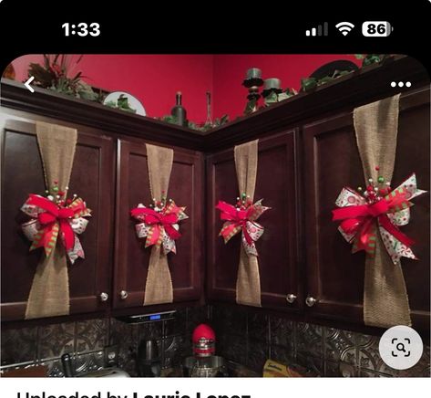 Christmas Cabnit Decorations, Cabinets Wrapped Like Presents, Top Of Kitchen Cabinet Christmas Decor Ideas, Kitchen Cabinet Door Christmas Decor, Christmas Cupboard Decorations, Present Cabinets Christmas, Christmas Kitchen Decor Ideas Cabinets, Christmas Cabinets Decorating Ideas, Kitchen Cabinet Christmas Decor