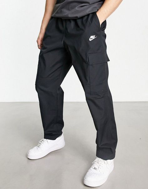 Trousers & Chinos by Nike Nike Club woven cargo trousers in black Style refresh: pending Regular rise Elasticated waistband Functional cargo pockets Logo embroidery Roomy cut for ease of movement and comfort Panelled leg construction Regular, tapered fit Cargo Nike, Mens Club, Cargo Trousers, Logo Embroidery, Nike Pants, Black Style, Embroidery Logo, Cargo Pants, Black Fashion