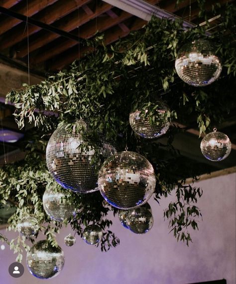 Disco And Greenery, Disco Balls With Greenery, Disco Ball And Greenery Ceiling, Greenery And Disco Balls, Disco Ball And Greenery, Evermore Themed Party, Disco Boho Wedding, Disco Forest, Disco Ball Centerpiece