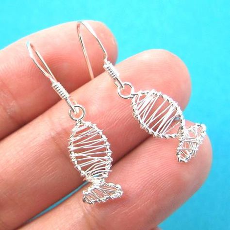 A pair of sterling silver fish shaped wire wrapped dangle earrings! They are made in the shape of a fish and are simple, cute and allergy free! For more sea themed animal jewelry please visit our stor