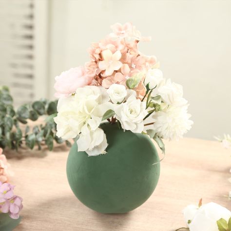 [About] Quantity: 6": 3 Foam Balls 10": 2 Foam Balls 8", 12", 14": 1 Foam Ball Material: Styrofoam Color: Green Shape: Sphere Can be used for real, dried, or artificial flowers How to use: Soak in water until completely saturated. Cut foam to desired size to fit any container. Then add flowers. Features: Lightweight, Quick water absorption, Great holding power & Low drainage Wet Foam gives longer life to your plant and flower arrangements Wet Foam provides great structure to floral designs [Information] Additional Information: Perfect for holding silk flower stems, heavy-stemmed naturals (like branches and twigs) and floral picks in place Recommended for indoor and outdoor use Note: Item is only for Styrofoam ball. Other decorations are not included.