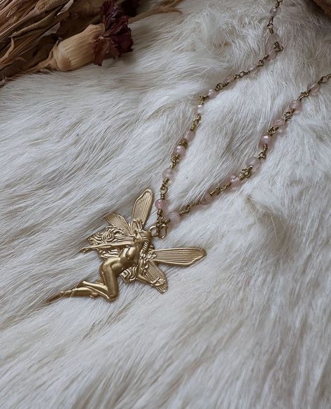 These gorgeous ethereal necklaces are made out of real rose quartz beads and brass chain. The fairy charm is vintage brass. These necklaces make a beautiful complement to any occasion and outfit 🦋 ️  Unleash your inner ethereal fairy 🌙 Necklace length I'm wearing is 19 inches Charm size - 1-1/4" wide by 1-3/4" tall            30mm x 43mm. Fairies and nymphs are a bit different in comparison but also very alike. Nymphs are usually human sized and extremely beautiful and ethereal beings. Fairies Fairy Pendant Necklace, Gold Fairy Necklace, Human Like Creatures, Cottagecore Necklace, Beaded Fairy, Ethereal Fairy, Ethereal Jewelry, Necklace Fairy, Crystal Beaded Necklace