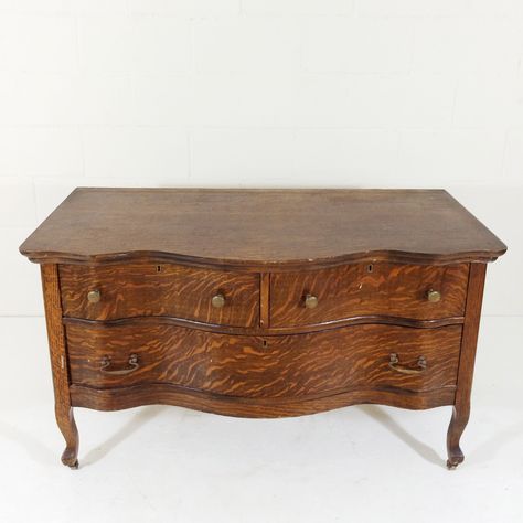 Antique Tiger Oak 3 Drawer Dresser. This low dresser is in good condition with standard wear and tear. It has a beautifully shaped serpentine front, dovetailed drawers and comes with all original solid brass hardware including casters.  Dimensions 46"w x 22.5"d x 27"h   $225 Antique Lowboy Dresser, Tiger Oak Dresser, Serpentine Dresser, Boy Dresser, Lowboy Dresser, Low Dresser, Oak Dresser, Tiger Oak, 3 Drawer Dresser