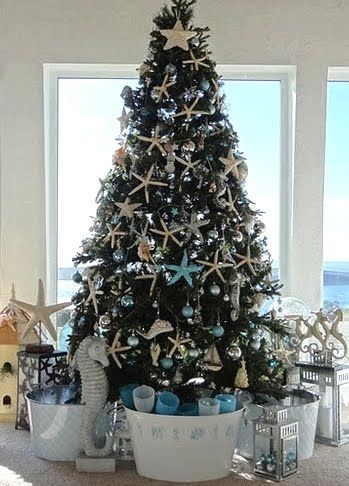 christmas decorations with seashells | grand Christmas Holiday tree in a Tiny Cottage in Coastal California ... Christmas Tree Sea Theme, Ocean Christmas Tree, Ocean Themed Christmas Tree, Under The Sea Christmas Tree, Alaska Christmas, Beach Christmas Tree, Beach Trees, Shark Christmas, Theme Tree