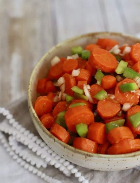 This recipe for Copper Pennies which are also known as Marinated Carrots or Sweet and Sour Carrots consist of carrot medallions marinated in a tangy tomato sauce. It's the best carrot side dish ever and is perfect for an Easter or Mother's Day brunch or dinner. You might say its "Copper Pennies from Heaven"! #copperpenniesrecipe, #carrotrecipes Copper Penny Salad, Marinated Carrots, Easter Dinner Side Dishes, Recipe With Carrots, Easter Dinner Sides, Easter Side Dish, Marinated Salad, Copper Pennies, Carrots Side Dish