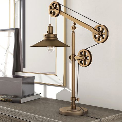 This brushed brass table lamp counterbalances function and design. It features an adjustable pulley system allowing you to personalize your space. Adjustable Lamp, Pulley System, Industrial Table Lamp, Bronze Table, Reading Lamp Floor, Cool Lamps, Cfl Bulbs, Metal Desks, Cool Floor Lamps